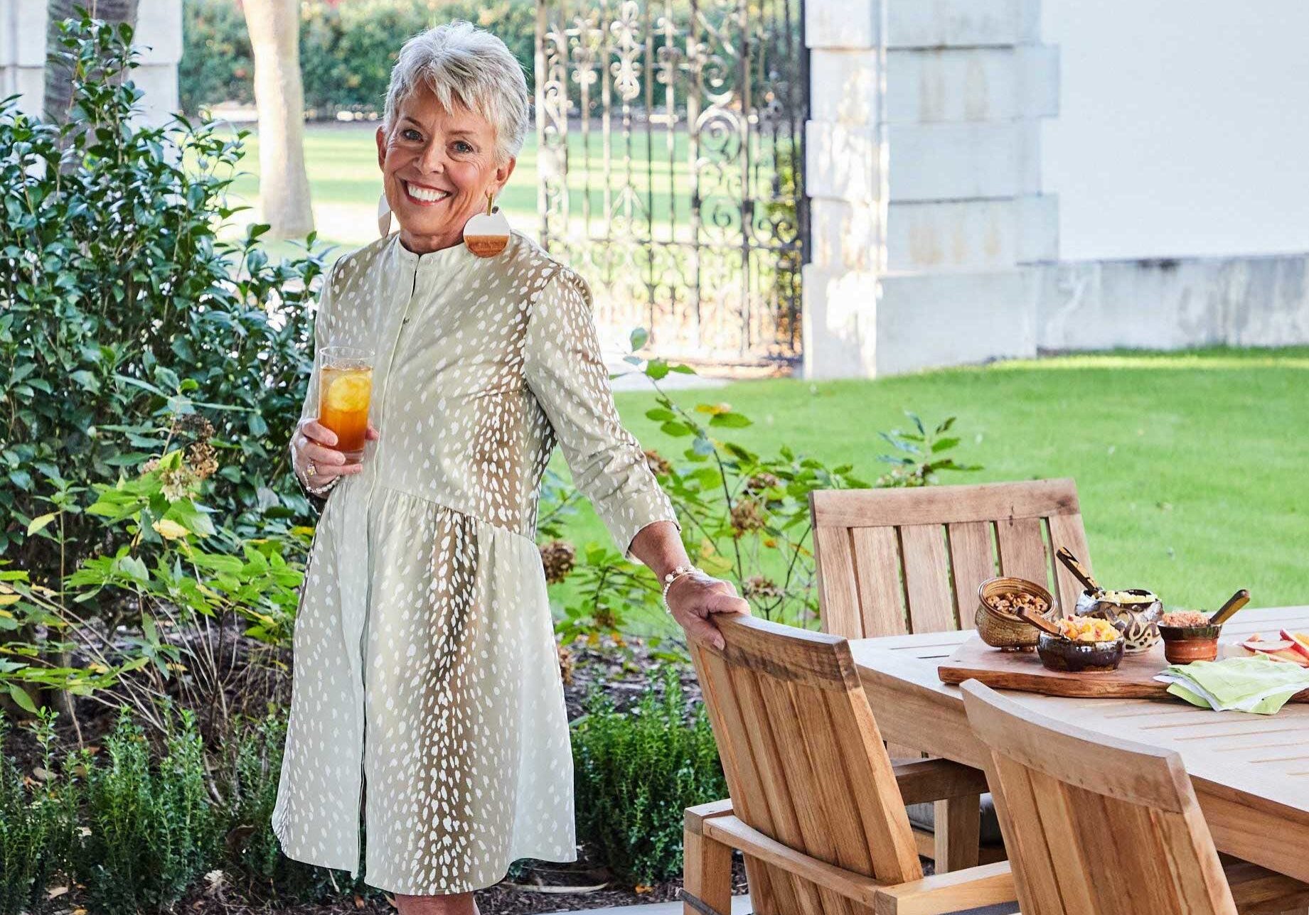 Vera holding a glass of iced tea